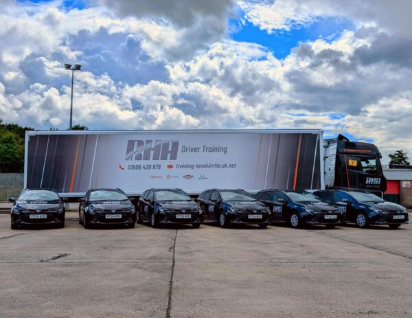 Corolla commercials parked in front of RHA Lorry